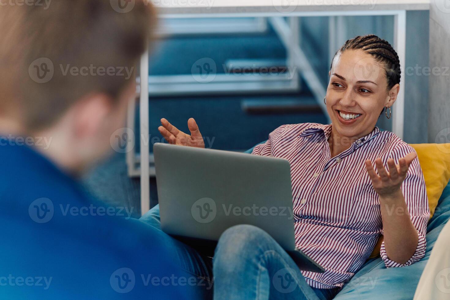 A modern programmer discussing future business projects with colleagues in a modern startup office photo