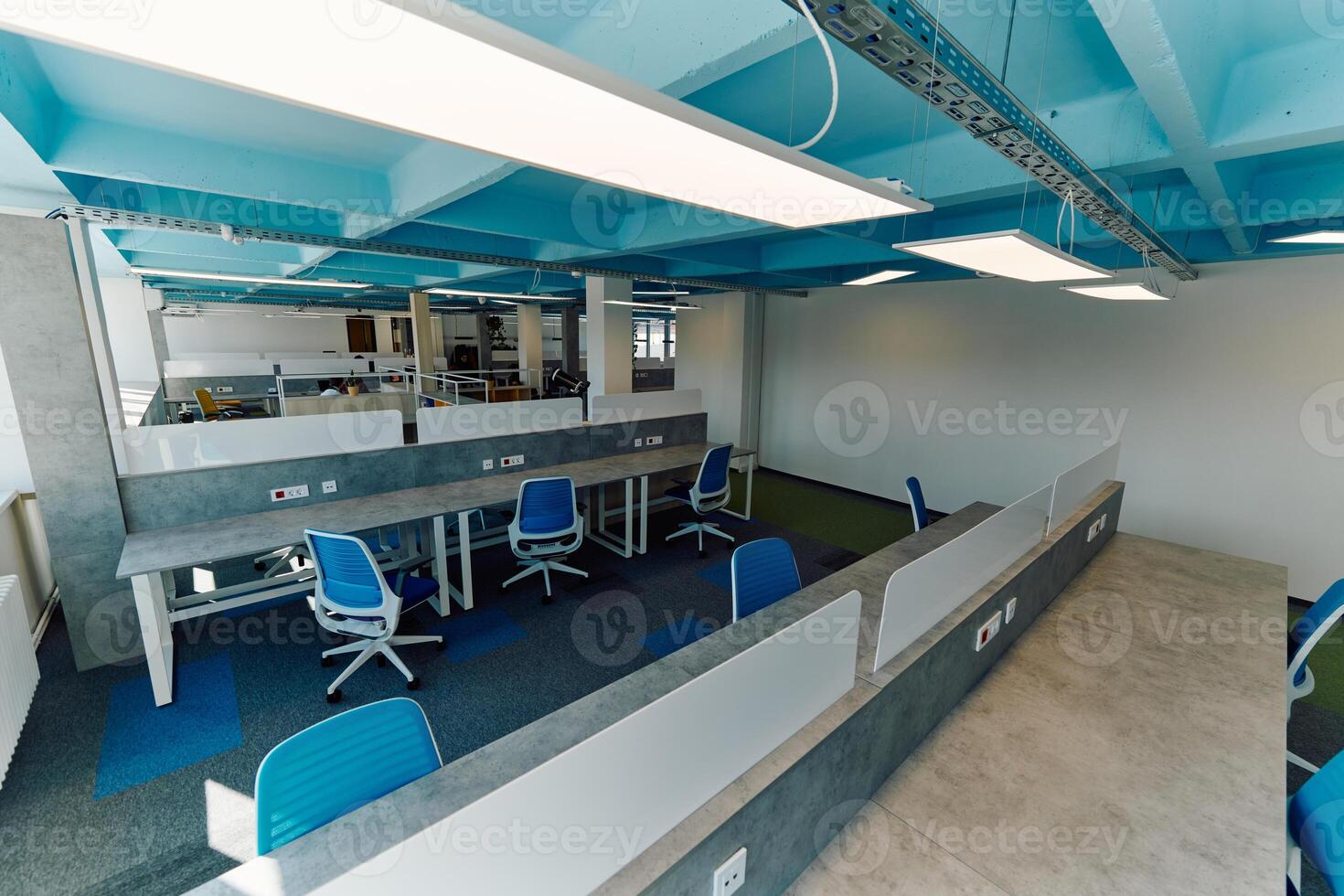 Photo of a modern office where programming, digital marketing and web design projects are done. Office with modern furniture and glass office