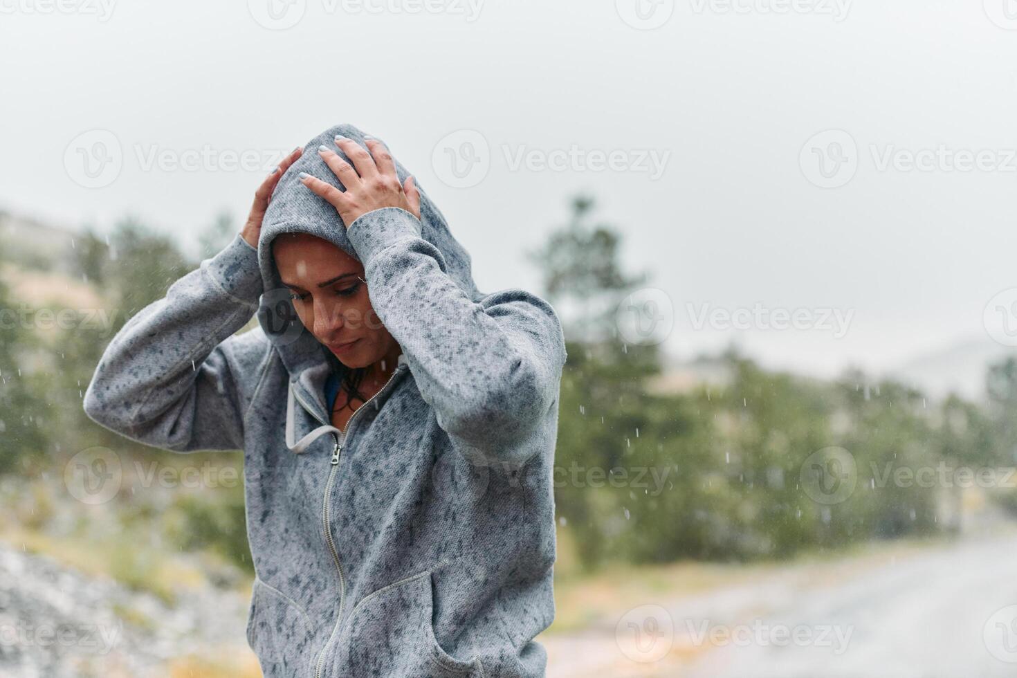 Woman Resting in the Rain After Intense Run photo