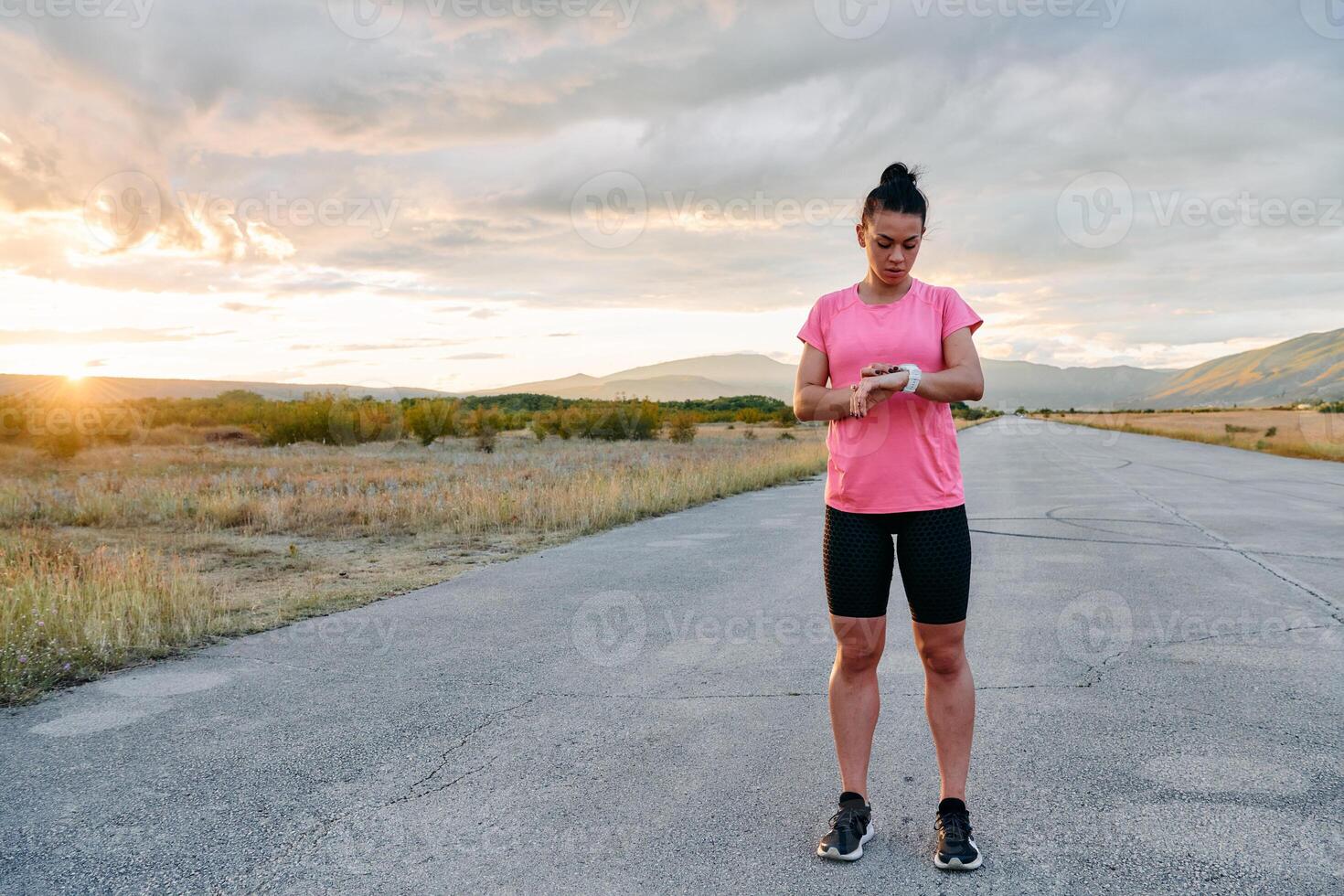 Athlete Stretching at Sunset After Intense Run photo