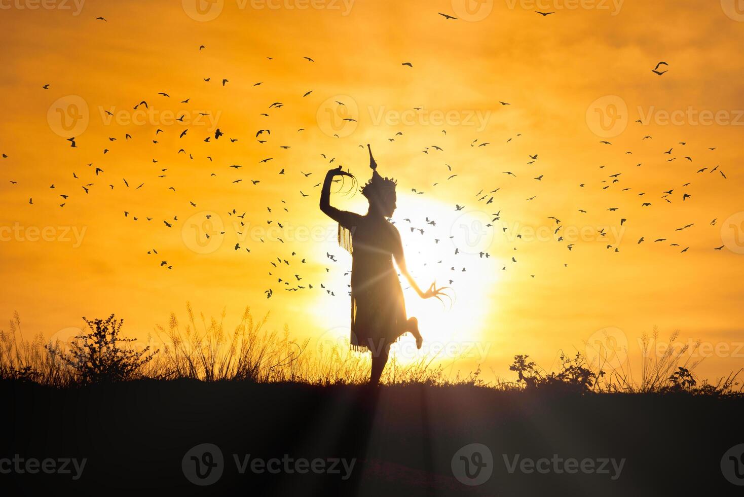Silhouette Manohra women dance with sunset in South of Thailand. photo