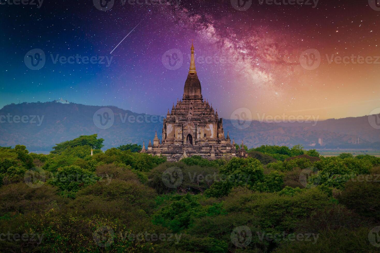 Landscape image of Ancient pagoda with milky way at night in Bagan, Myanmar. photo