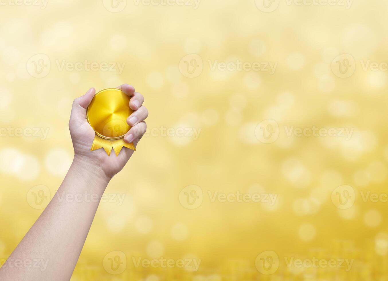 Holding a gold coin golden bokeh background photo