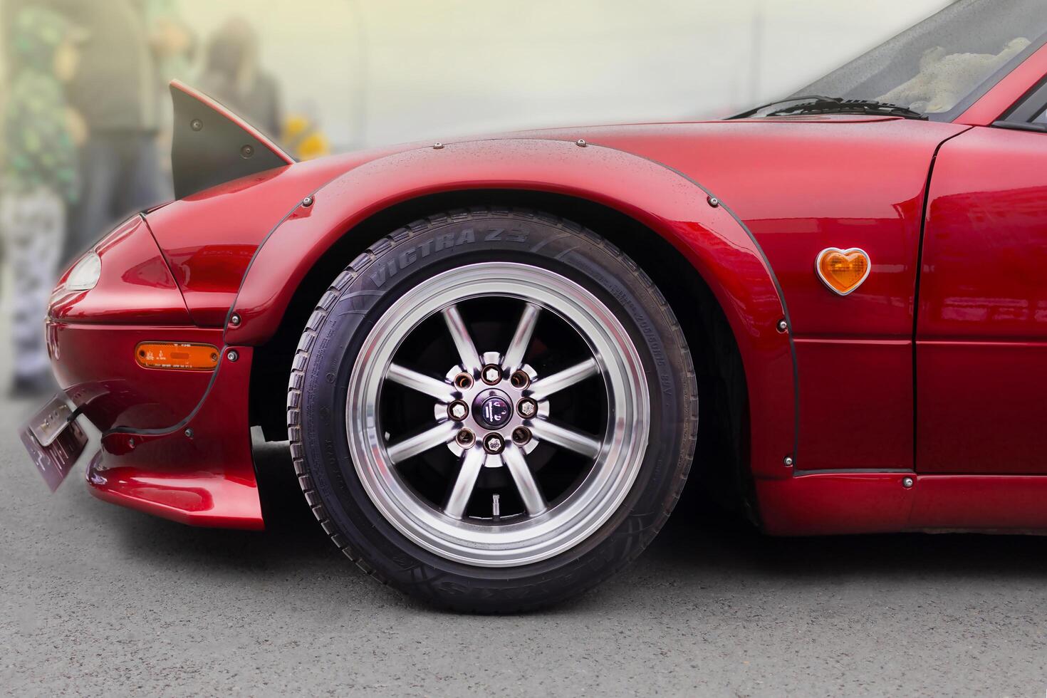 Russia, Novosibirsk, 25.05.2024 Midday, Red Mazda Miata MX-5 Roadster 1989, in tuning, Rocket Bunny Rear Bumper Extensions, pop-up headlights photo
