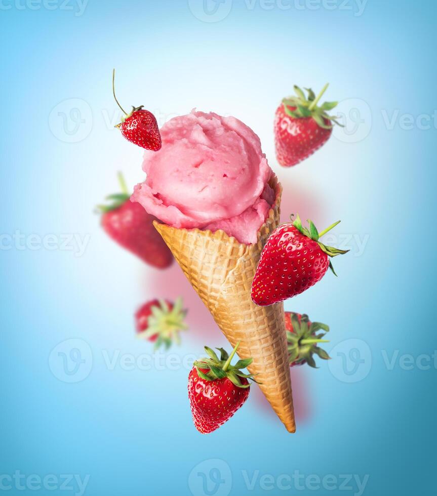 Composition levitation Strawberry ice cream waffle cone with Strawberries on blue background. In the air, vertical photo