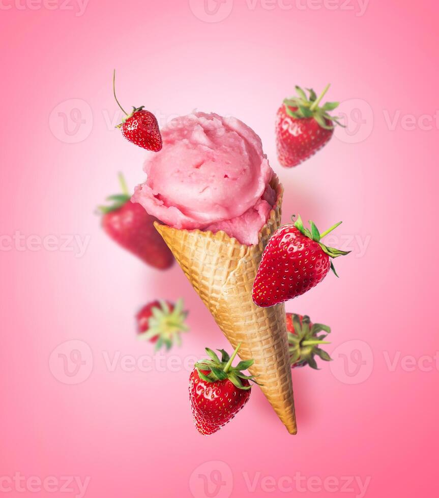 Composition levitation Strawberry ice cream waffle cone with Strawberries on pink background. In the air, vertical food photo banner