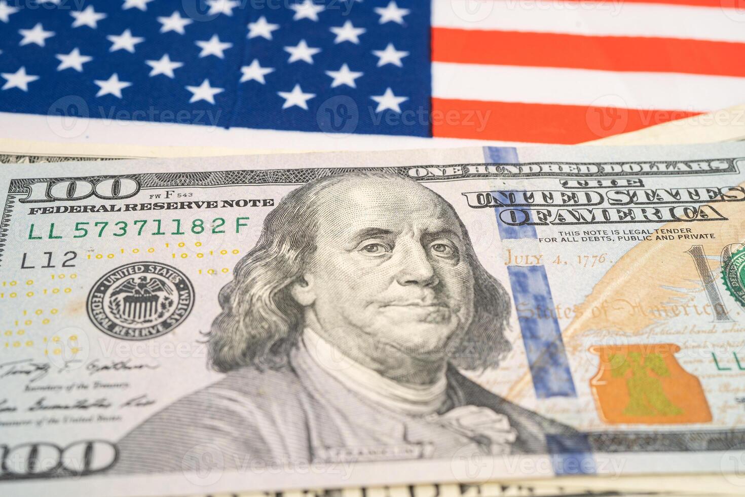US dollar banknotes on USA America flag background, Business and finance. photo