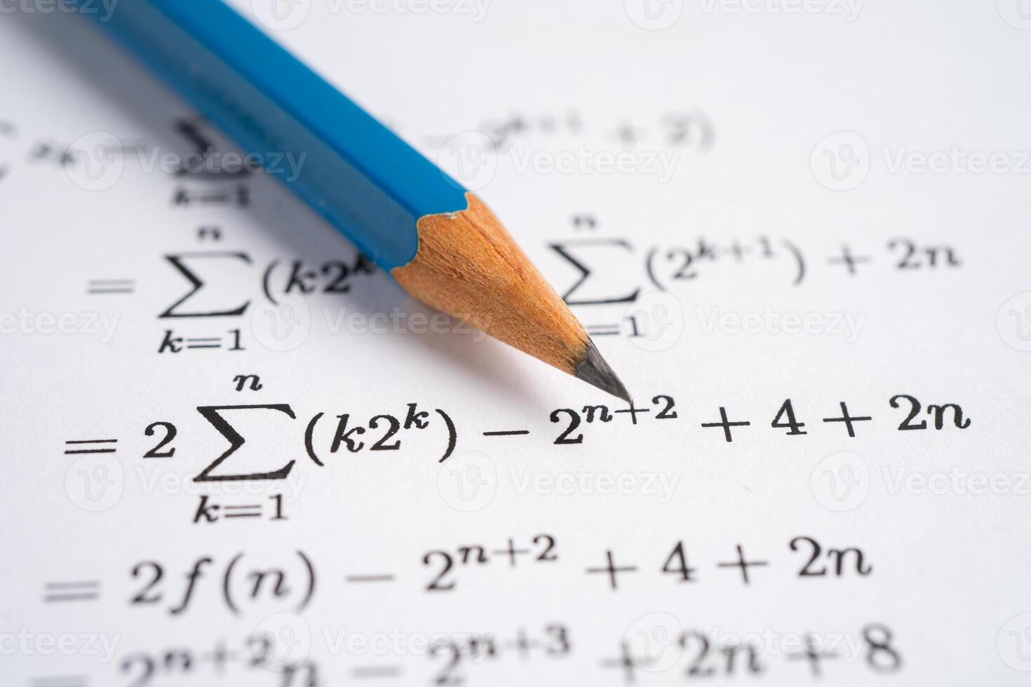 Pencil on mathematic formula exercise test paper in education school. photo