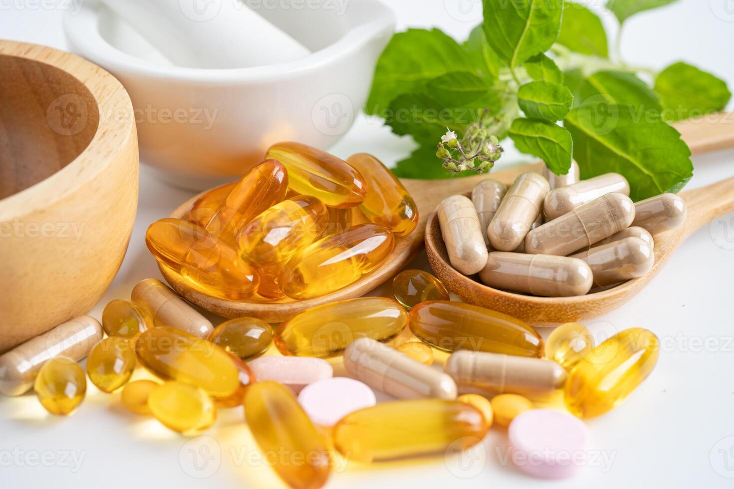 Alternative medicine herbal organic capsule with vitamin E omega 3 fish oil, mineral, drug with herbs leaf natural supplements for healthy good life. photo