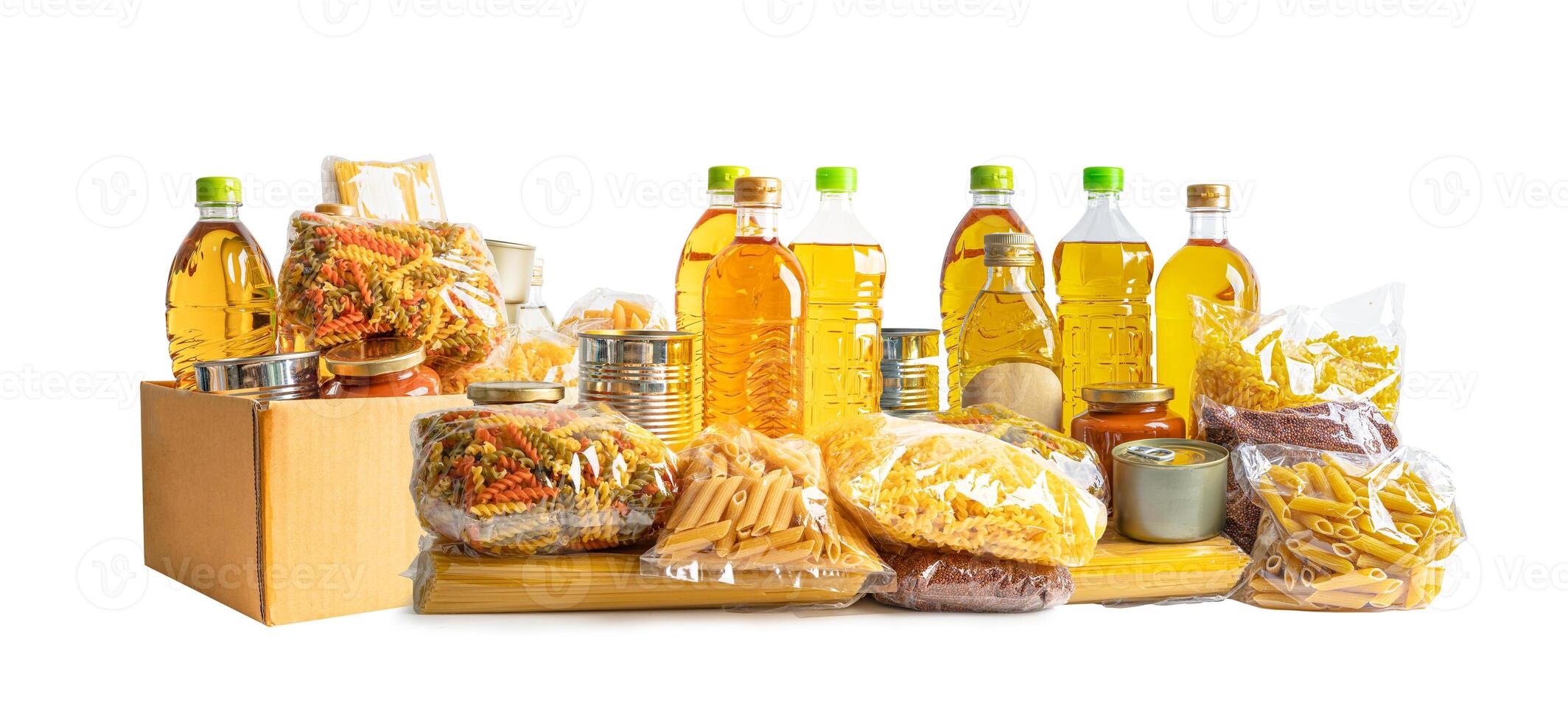 Foodstuff for donation, storage and delivery. Various food, pasta, cooking oil and canned food in cardboard box. photo