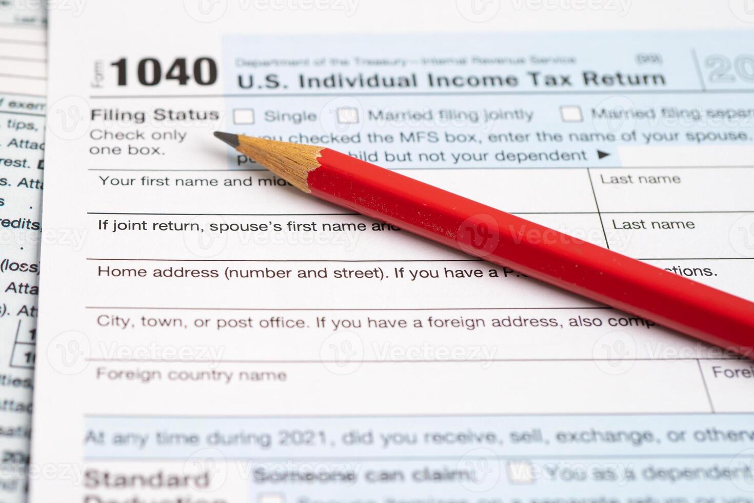 Tax Return form 1040 with pencil, U.S. Individual Income. photo