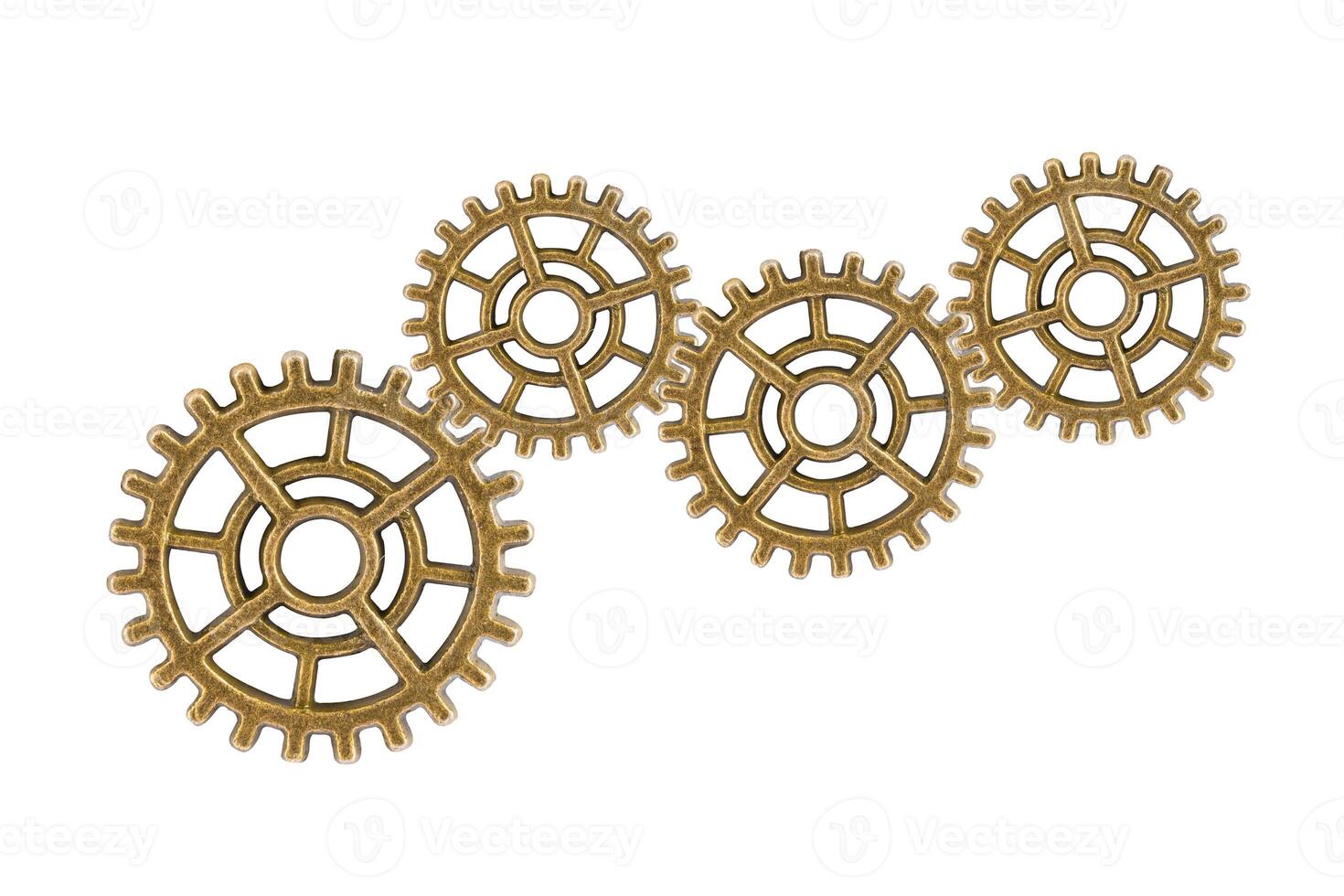 Gear and cogs wheels isolated on a white background, clock mechanism, brass metal engine industrial. photo