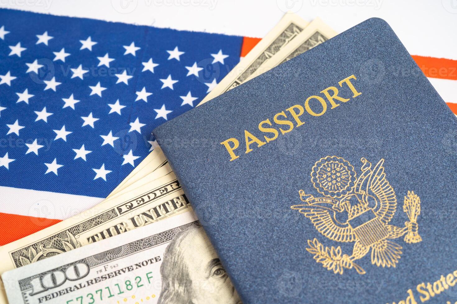US passport issued to citizen and national of the United States of America to travel in most countries outside with USA flag and dollar money. photo