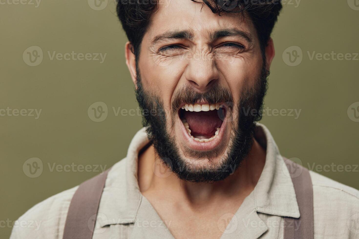 Man handsome casual studio caucasian expression person young mad model isolated portrait mouth photo
