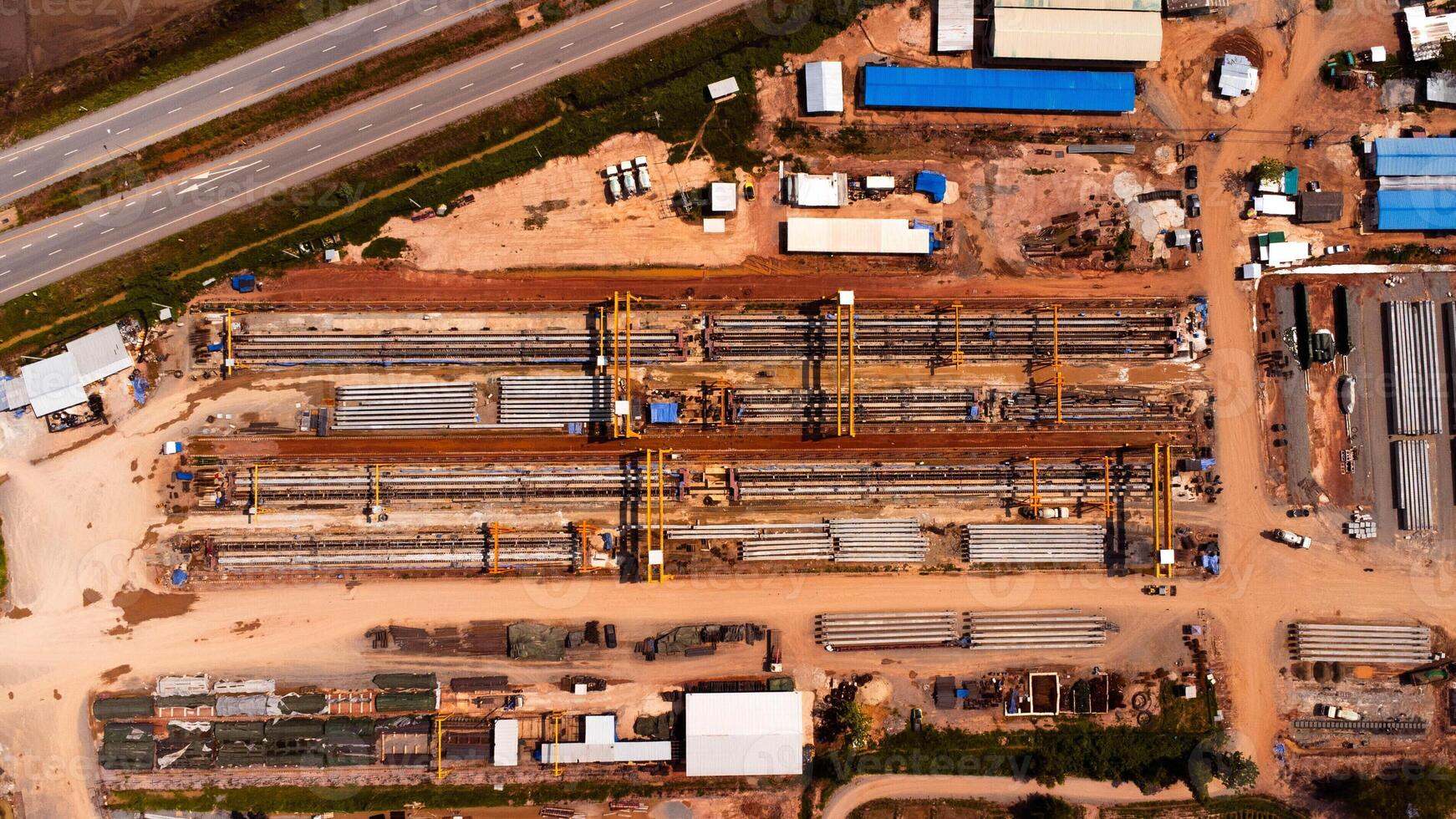 Aerial view of a cement bridge under construction. Road currently under construction at several levels to increase traffic photo