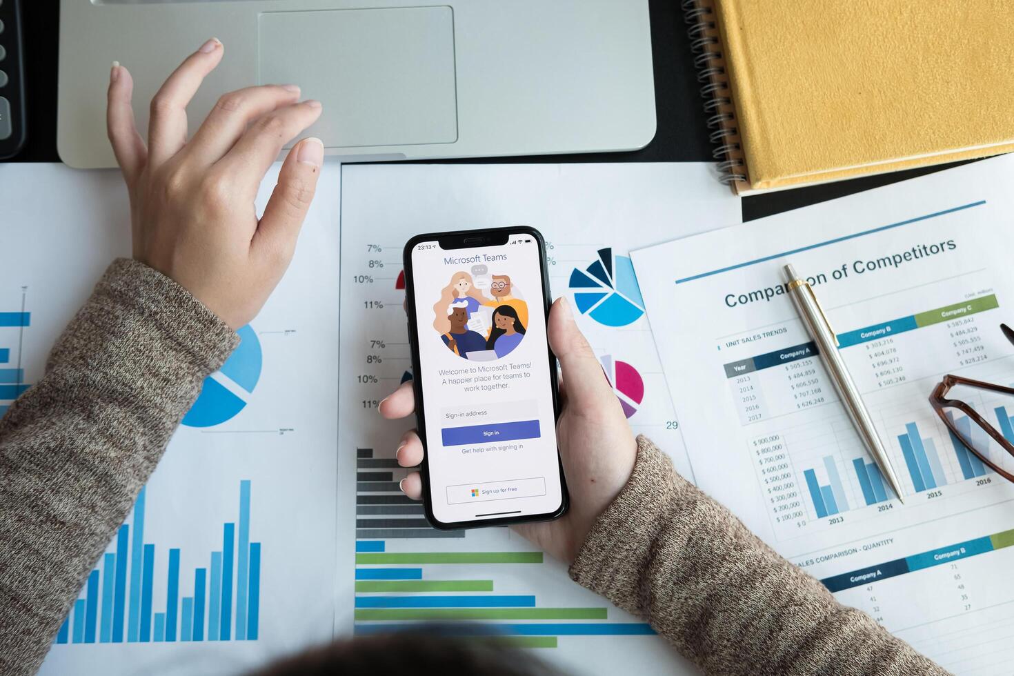 CHIANG MAI, THAILAND - APR 11, 2020 . A working from home employee is downloading the Microsoft Teams social platform, photo