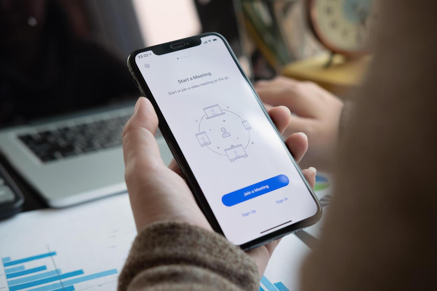CHIANG MAI, THAILAND - APR 11, 2020 . A working from home employee is downloading the Zoom application social platform, photo