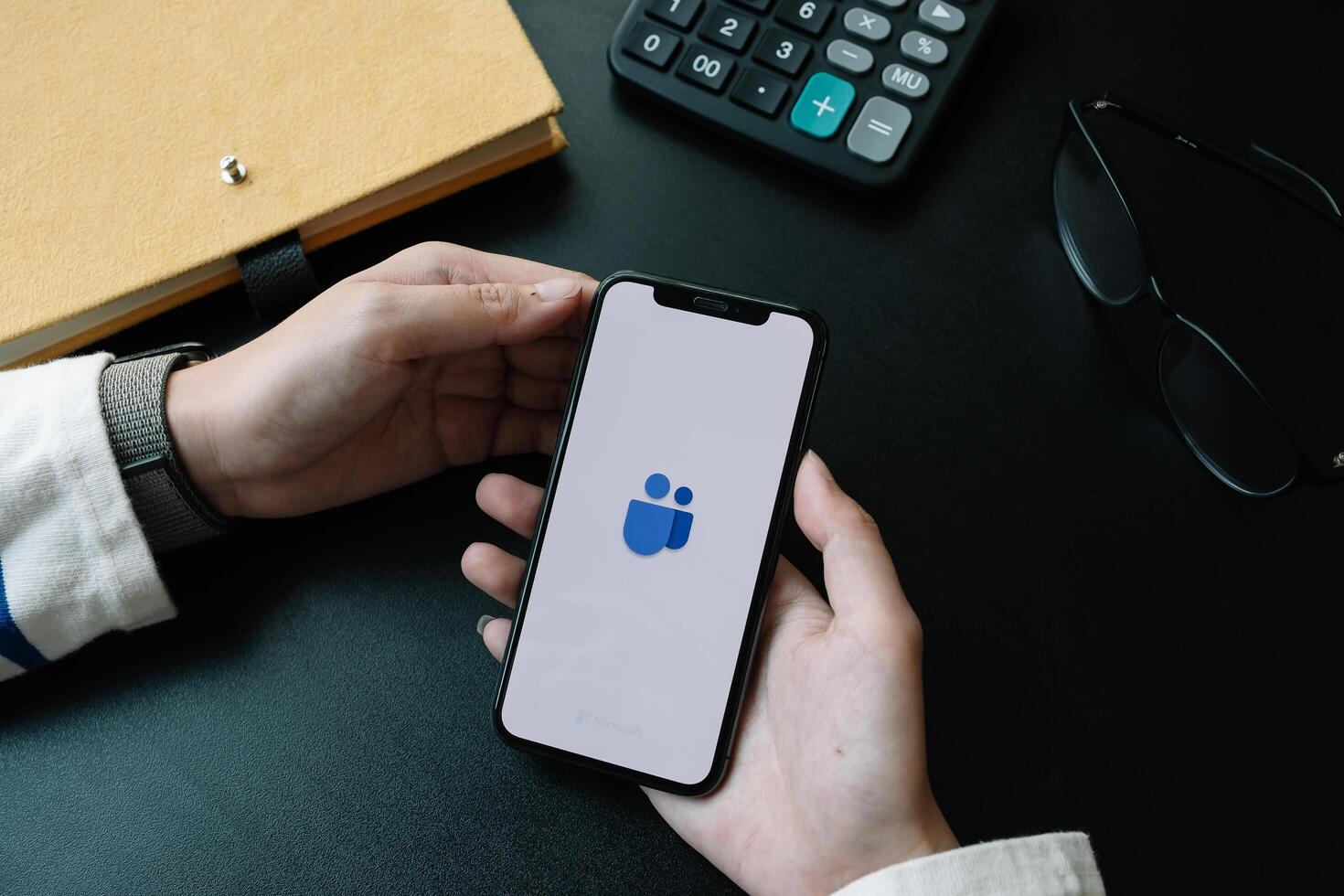 CHIANG MAI,THAILAND - APR 06, 2020 . A working from home employee is downloading the Microsoft Teams social platform, photo