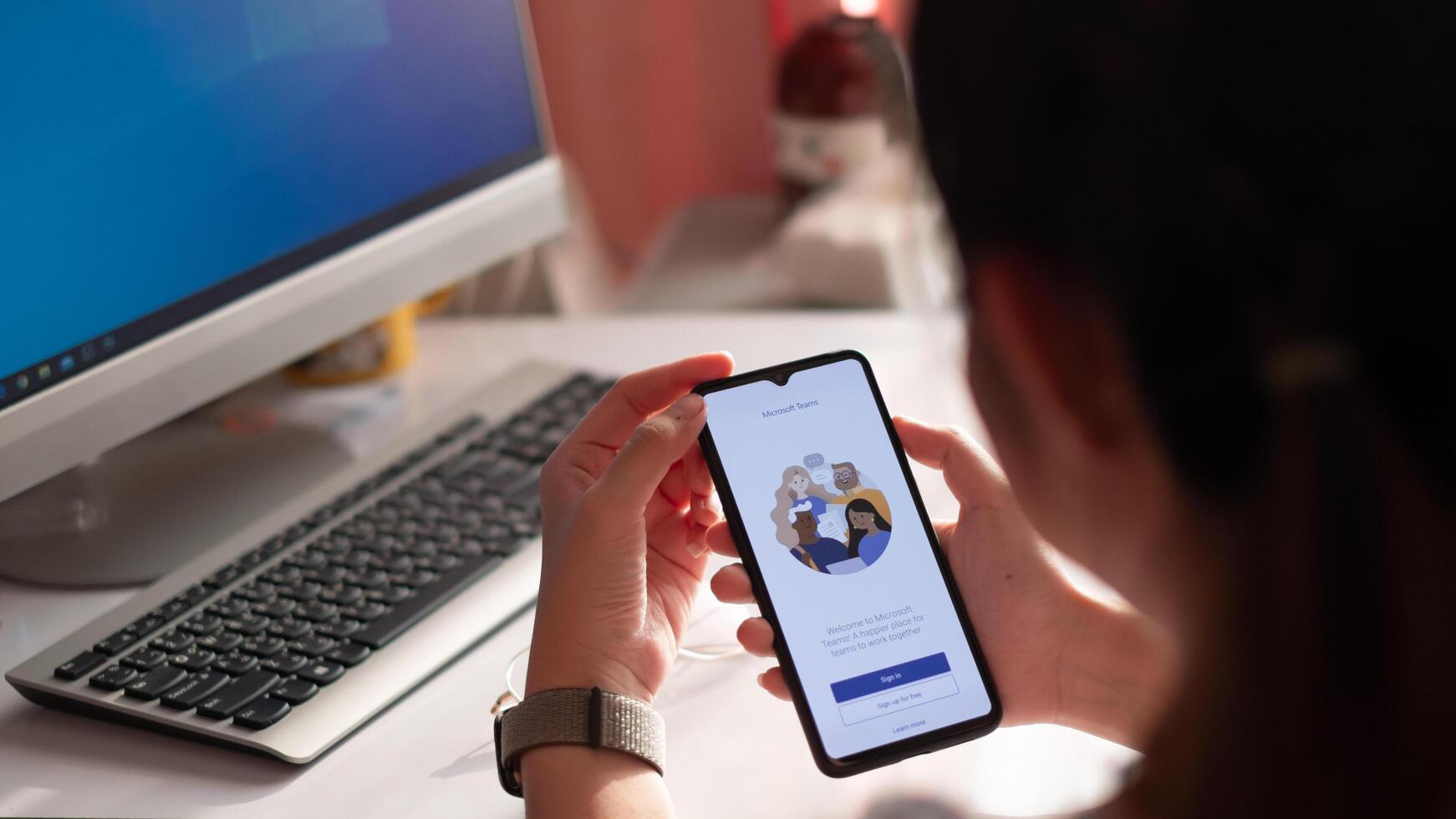 CHIANG MAI, THAILAND - MAY 24, 2020 . A working from home employee is downloading the Microsoft Teams social platform, photo