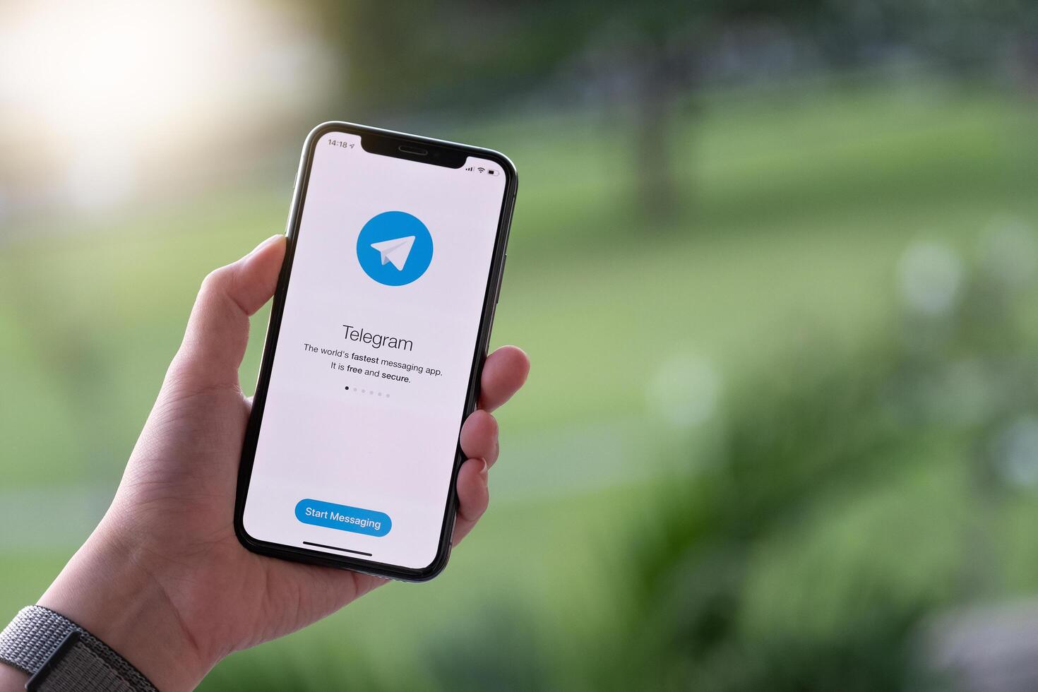 CHIANG MAI, THAILAND, NOV 17, 2019 . Woman hand holding iPhone X with Telegram photo