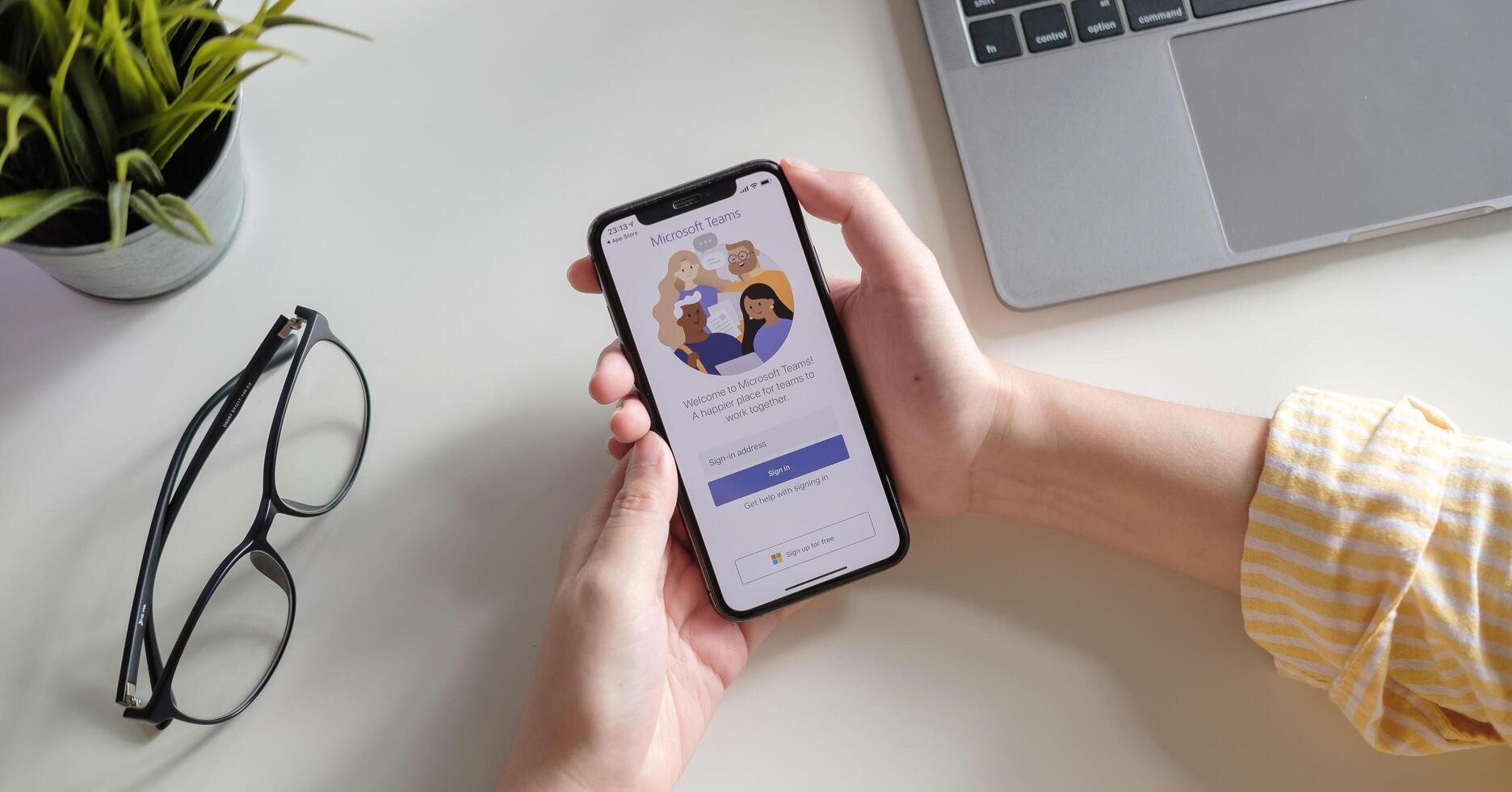 CHIANG MAI, THAILAND - JULY 3, 2020 . A working from home employee is downloading the Microsoft Teams social platform, ready for remote working in isolation from home. photo