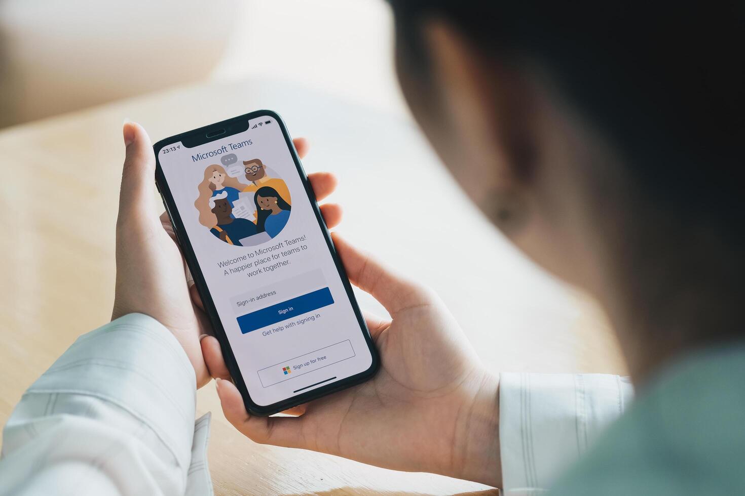 CHIANG MAI, THAILAND - JULY 26, 2020 . A working from home employee is downloading the Microsoft Teams social platform, ready for remote working in isolation from home photo