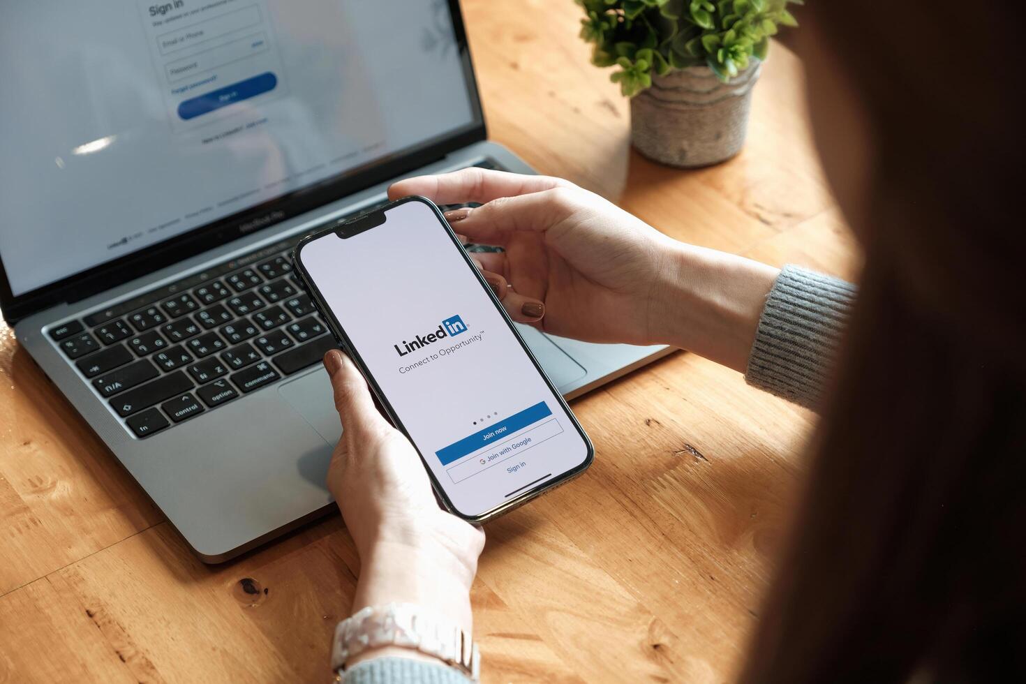 CHIANG MAI, THAILAND - OCT 17, 2021. iPhone 13 with LinkedIn application on the screen. LinkedIn is a business-oriented social networking service photo