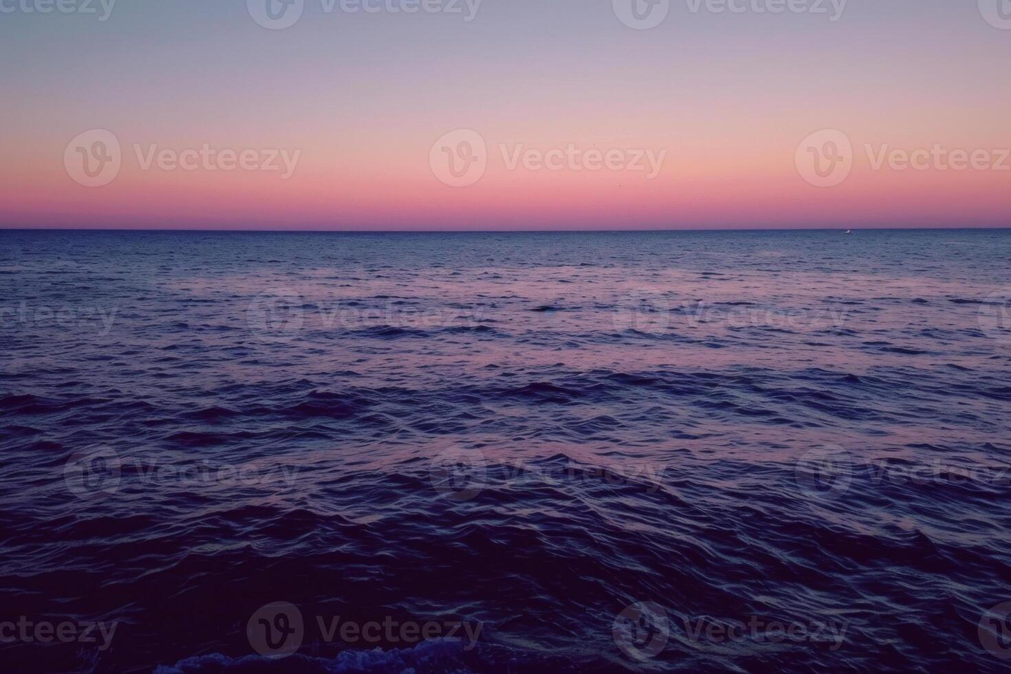 Serene ocean waves under pastel twilight sky photo