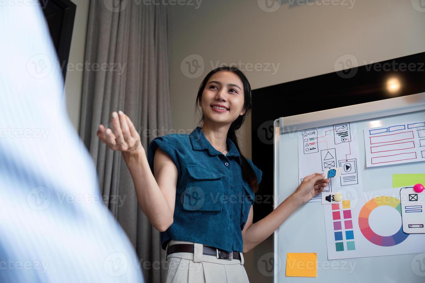 ux developer and ui designer presenting and testing mobile app interface design on whiteboard in meeting at modern office. Creative digital development mobile app photo