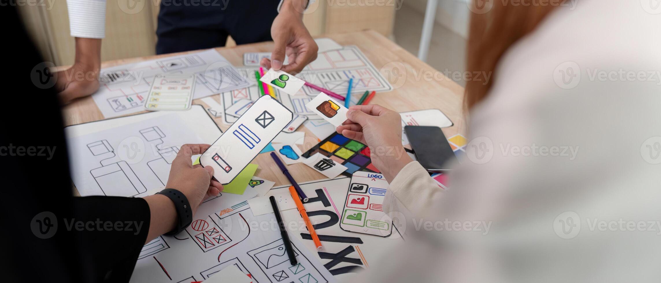Brainstorm team of creative web graphic designer planning, Group of mobile phone app developer team meeting for share ideas about screen prototype layout for smartphone. startup planning ui and ux photo