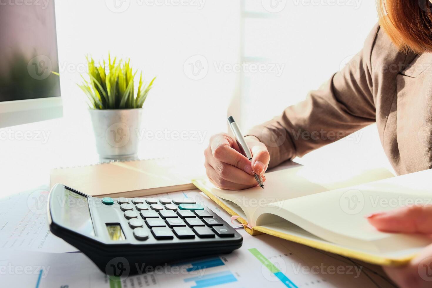 Close up Business Woman or Accountant Calculating Cost Economic photo