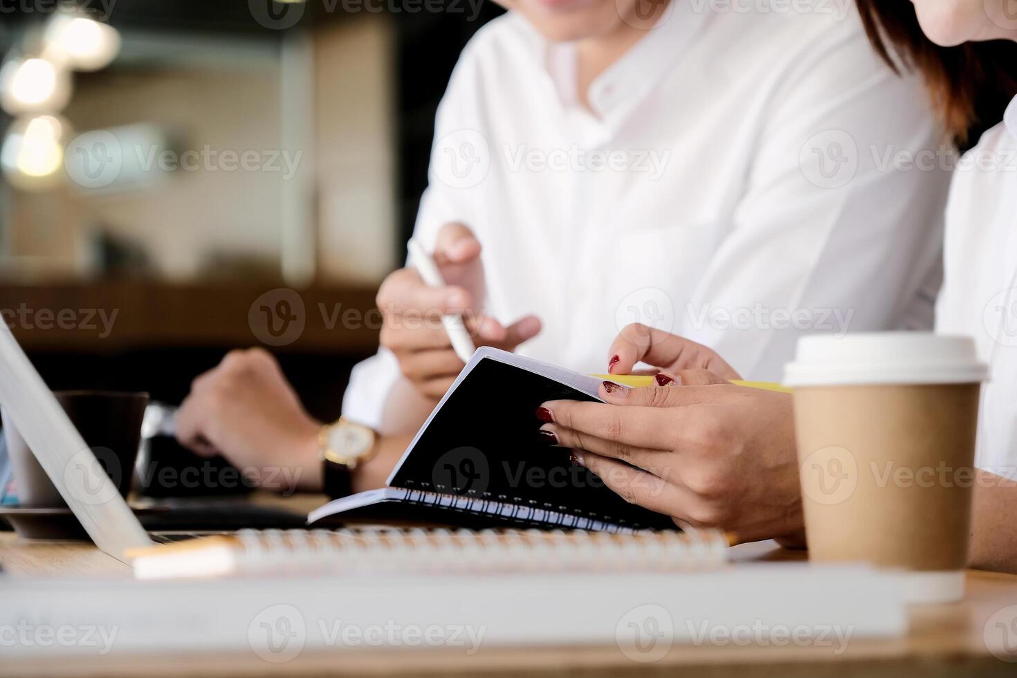Business team brainstorming and discussing financial report graph with laptop computer. Teamwork meeting working concept photo