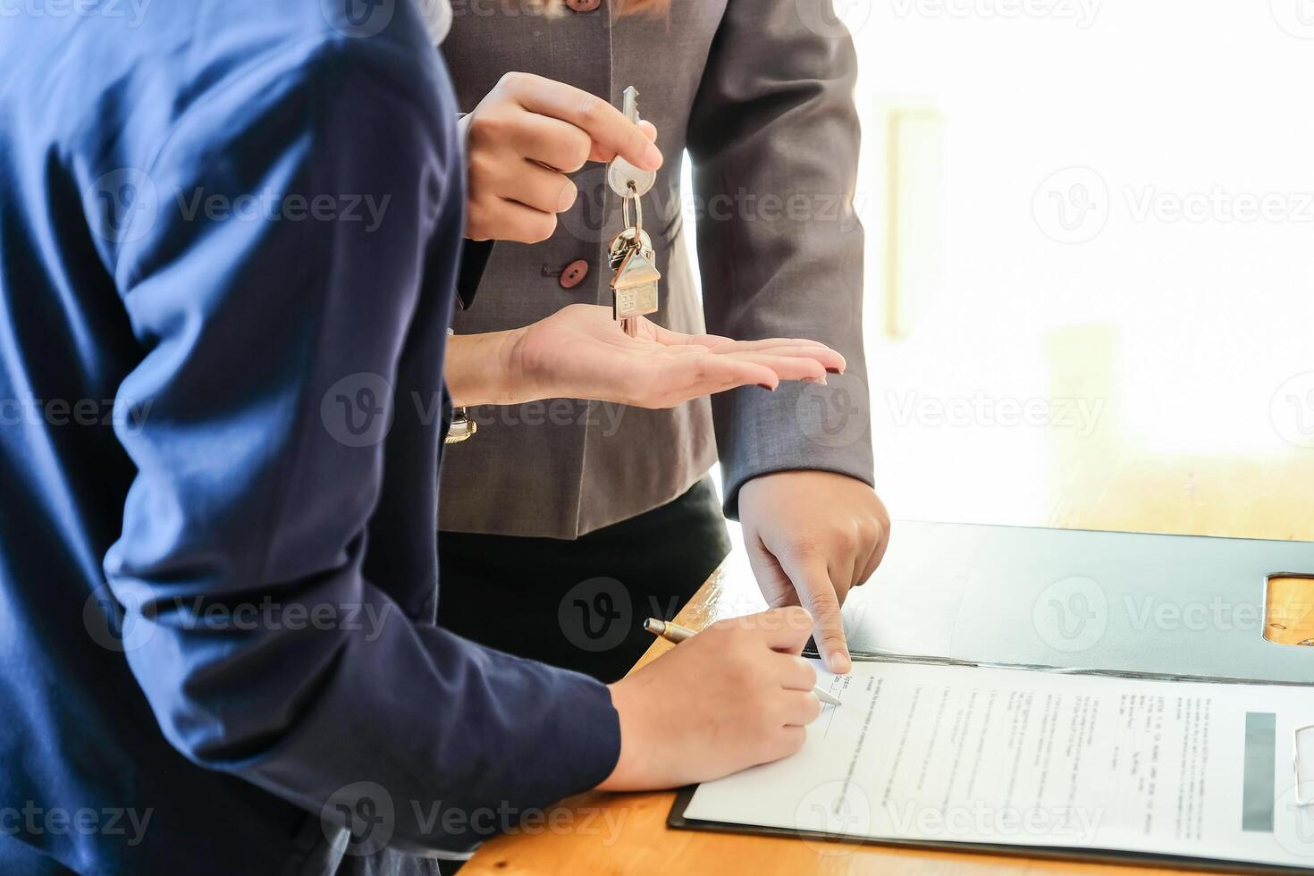 Real estate agent offer hand for customer sign agreement contract signature for buy or sell house. photo