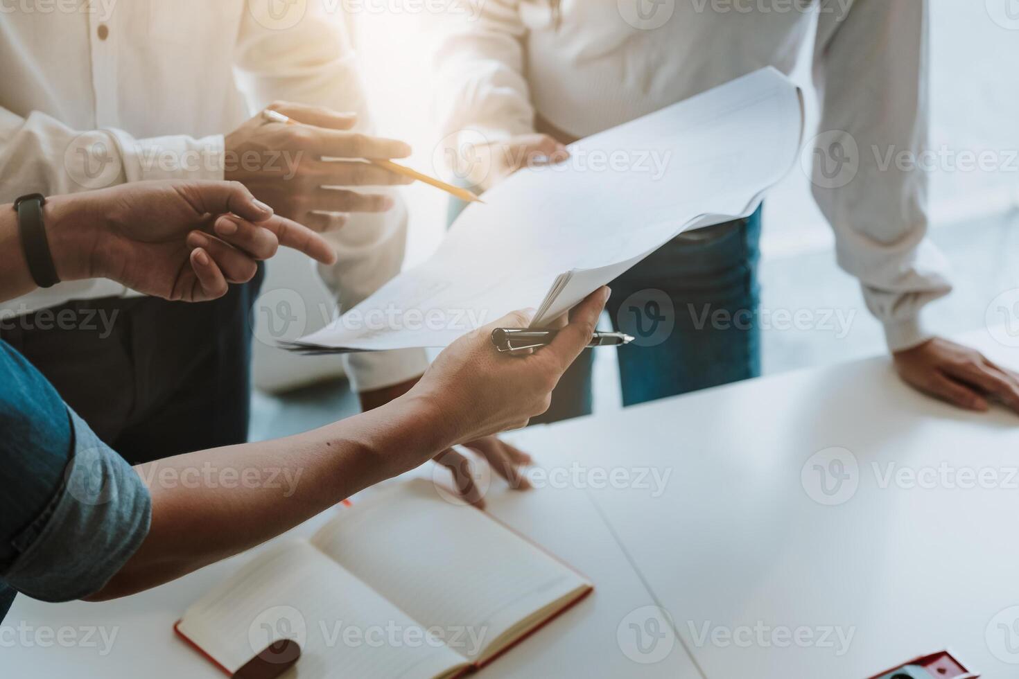 Architect and Engineer are meeting for project working with partner with blueprint photo