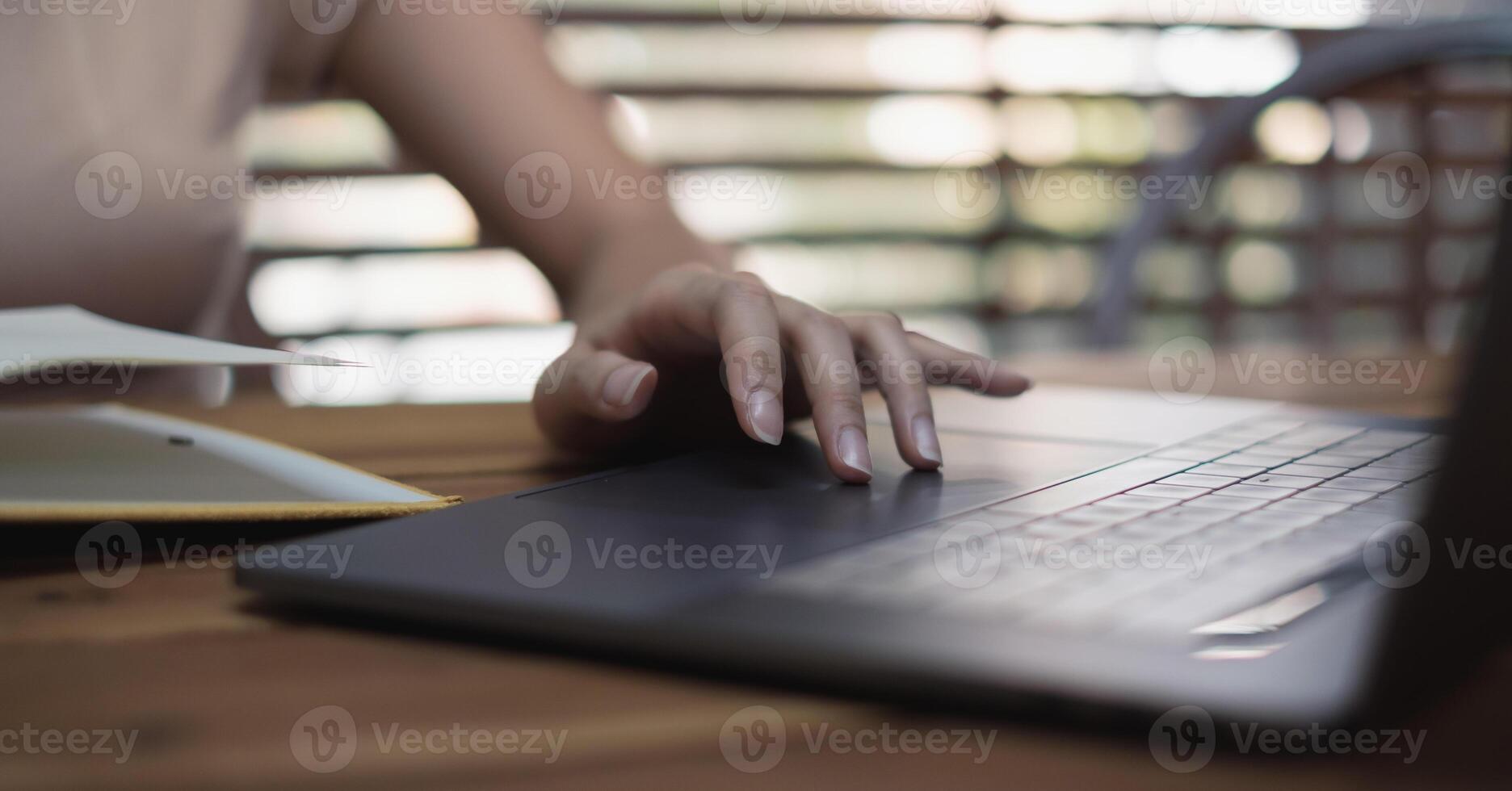 Close up Woman working at home office hand on keyboard for working or learning online photo