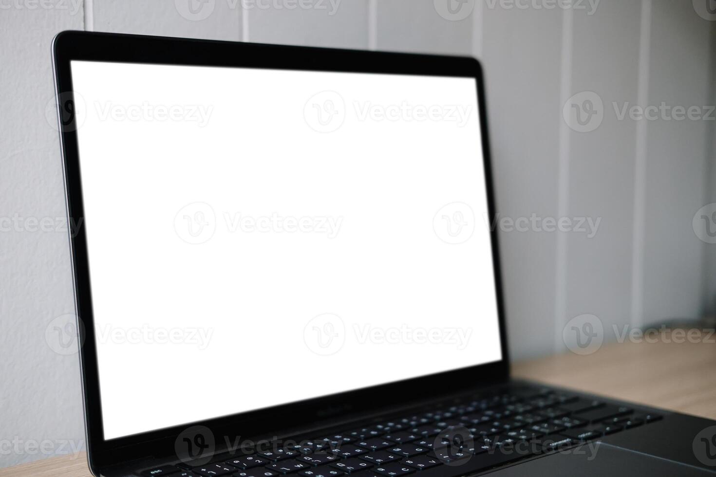 Computer mockup white background on table. Laptop with blank screen photo