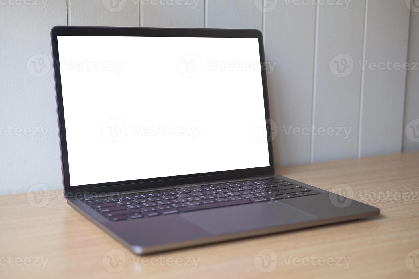 Computer mockup white background on table. Laptop with blank screen photo