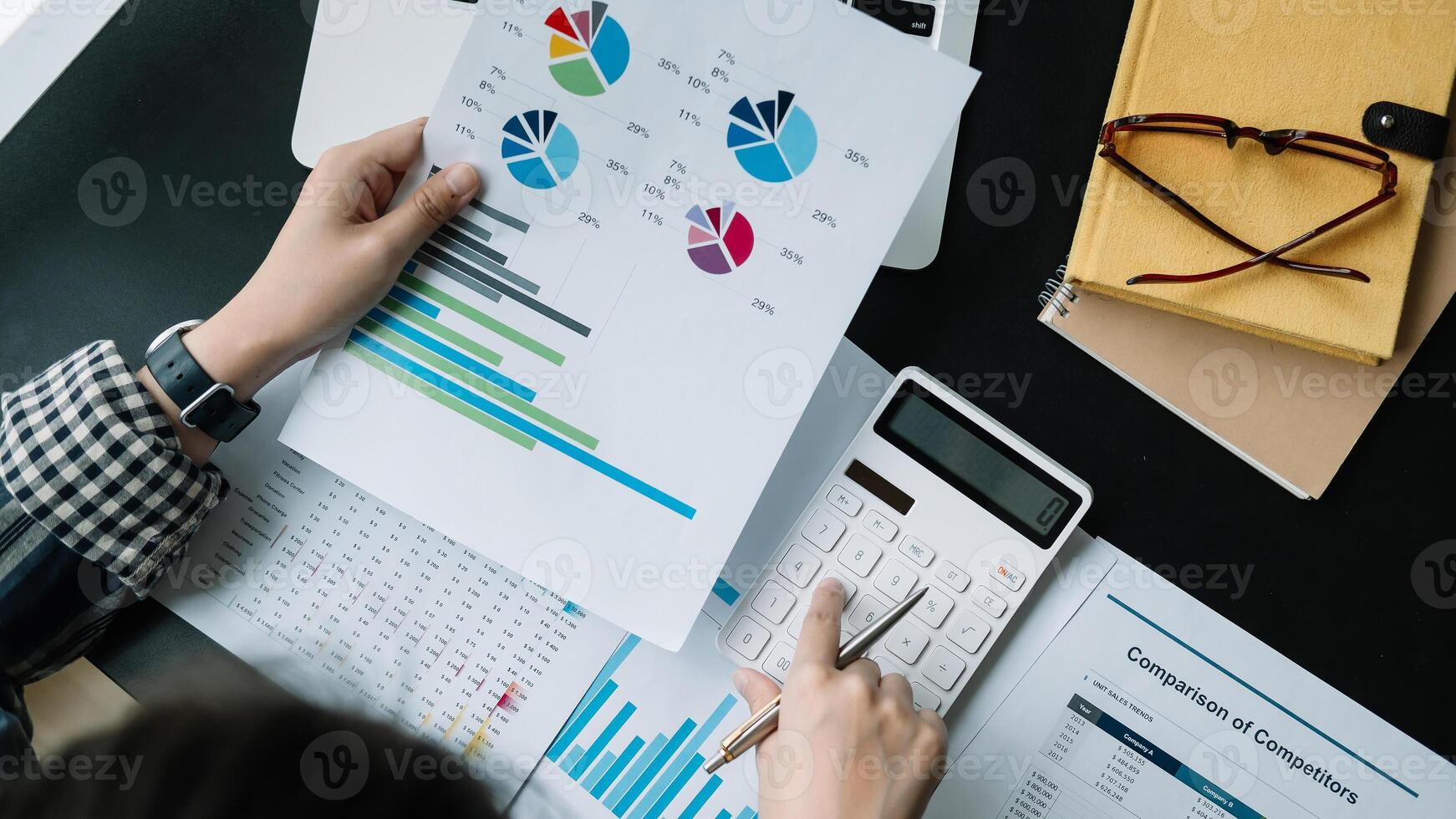 Close up Businessman using calculator and laptop for calculating finance, tax, accounting, statistics and analytic research concept photo
