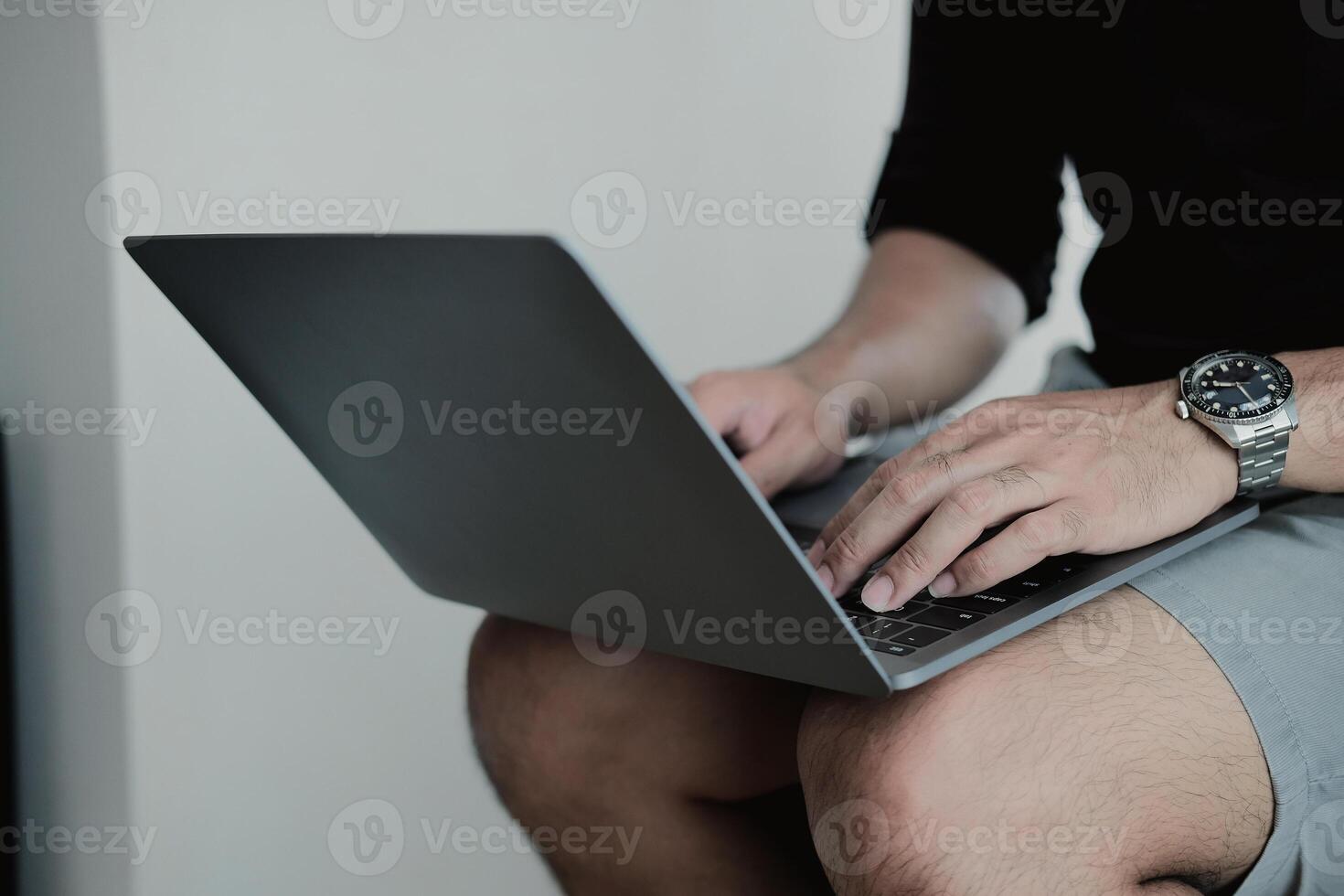 Close up man using smart laptop at home photo