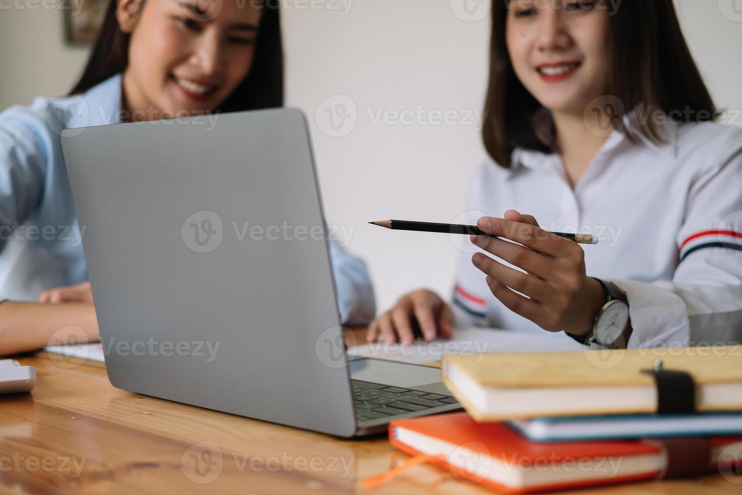 Asian business adviser meeting to analyze and discuss the situation on the financial report in the meeting room. Financial advisor and accounting concept photo