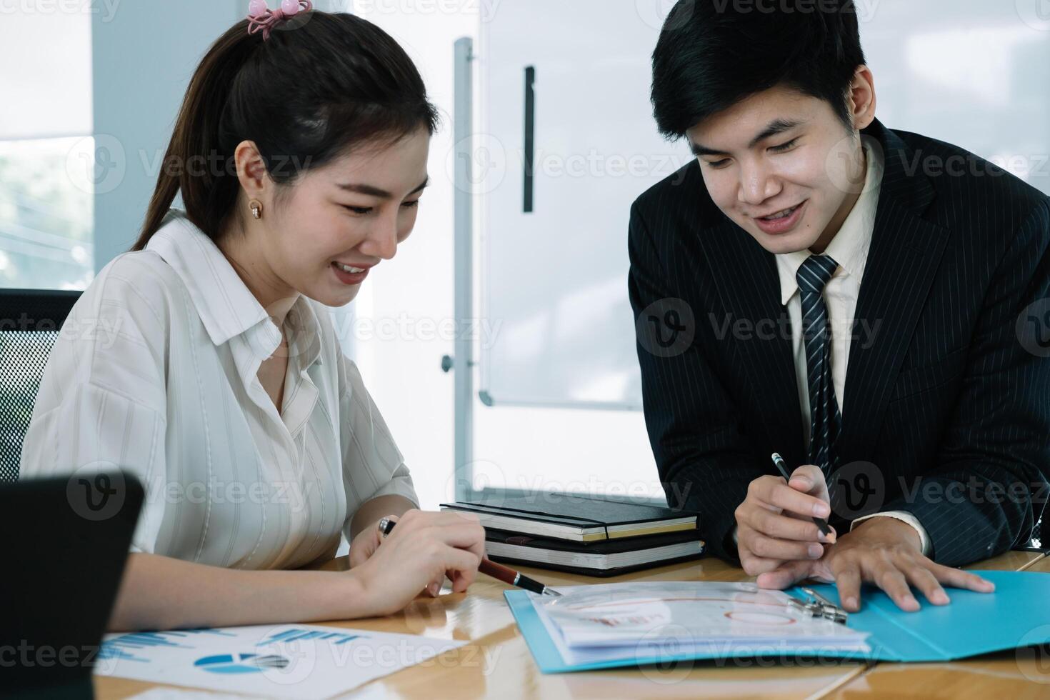 Young Asian Business people having a business meeting with executive photo