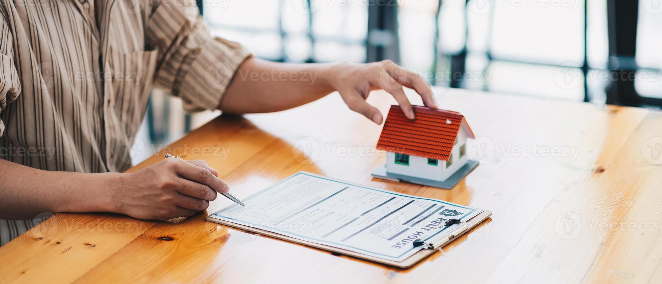 Real estate agent offer hand for customer sign agreement contract signature for buy or sell house. Real estate concept contact agreement concept photo