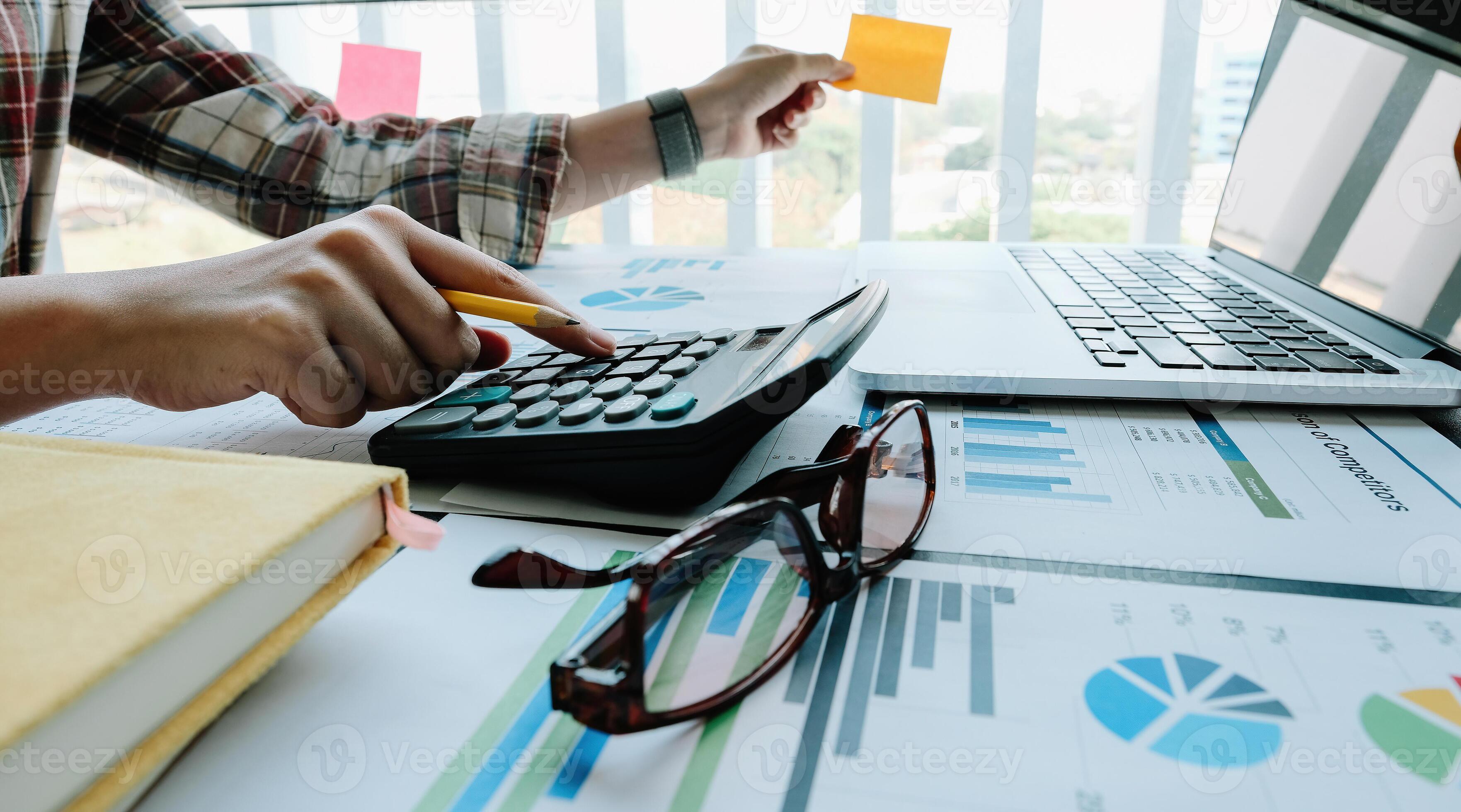 Close up business accounting concept, Business woman using calculator ...