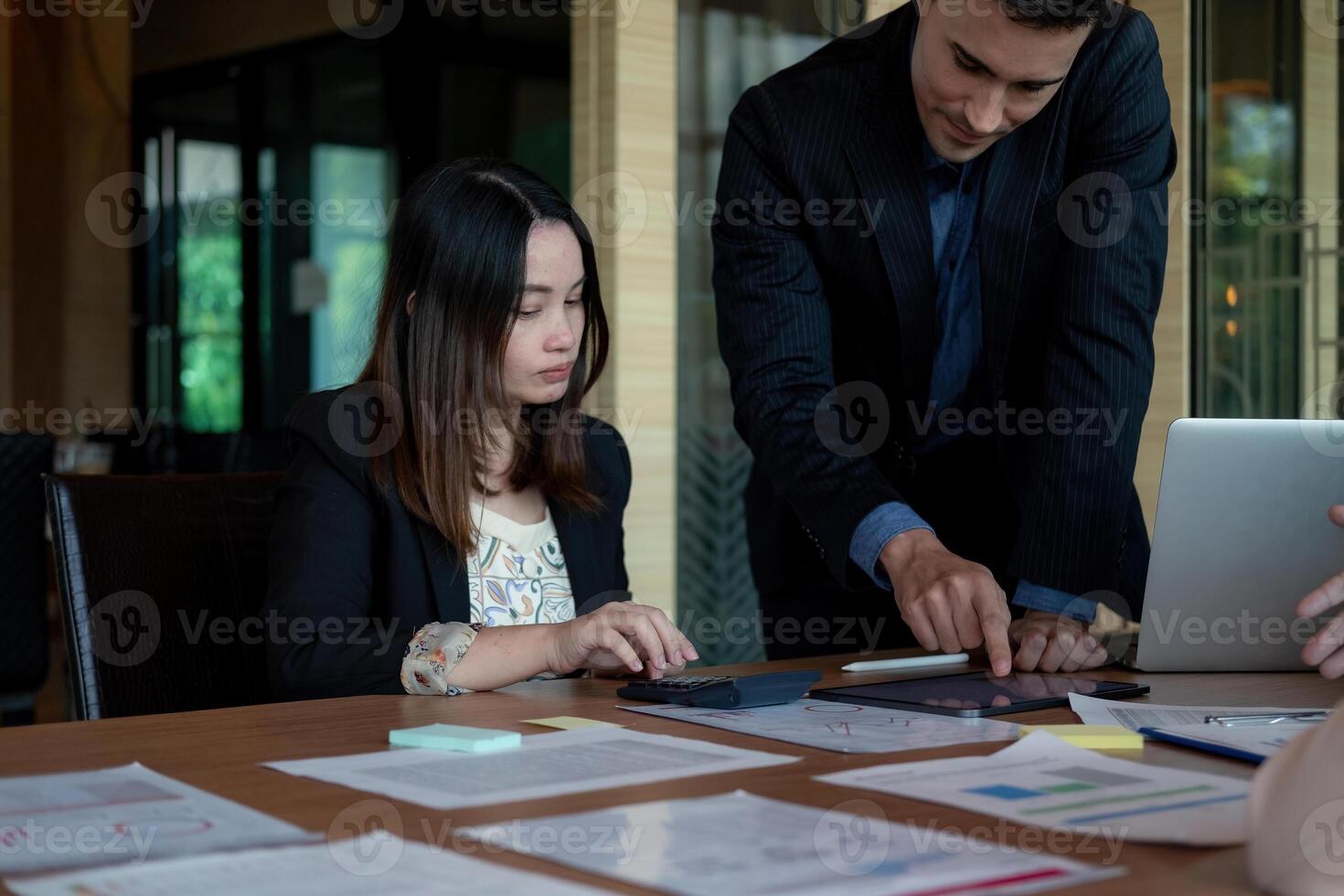 Business team discussing the charts and graphs showing the results at meeting accounting and financial photo