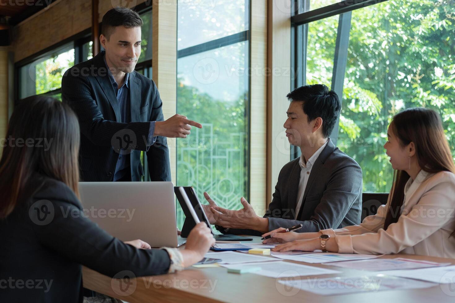 Group of business people busy discussing financial matter during meeting. Corporate Organization Meeting Concept. photo