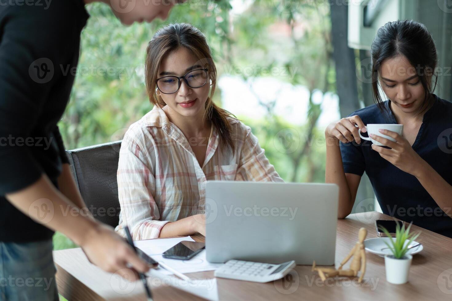 Business Asian people team discussing working analyzing with financial data and marketing growth report graph in team, presentation and brainstorming to strategy planning making profit of company. photo