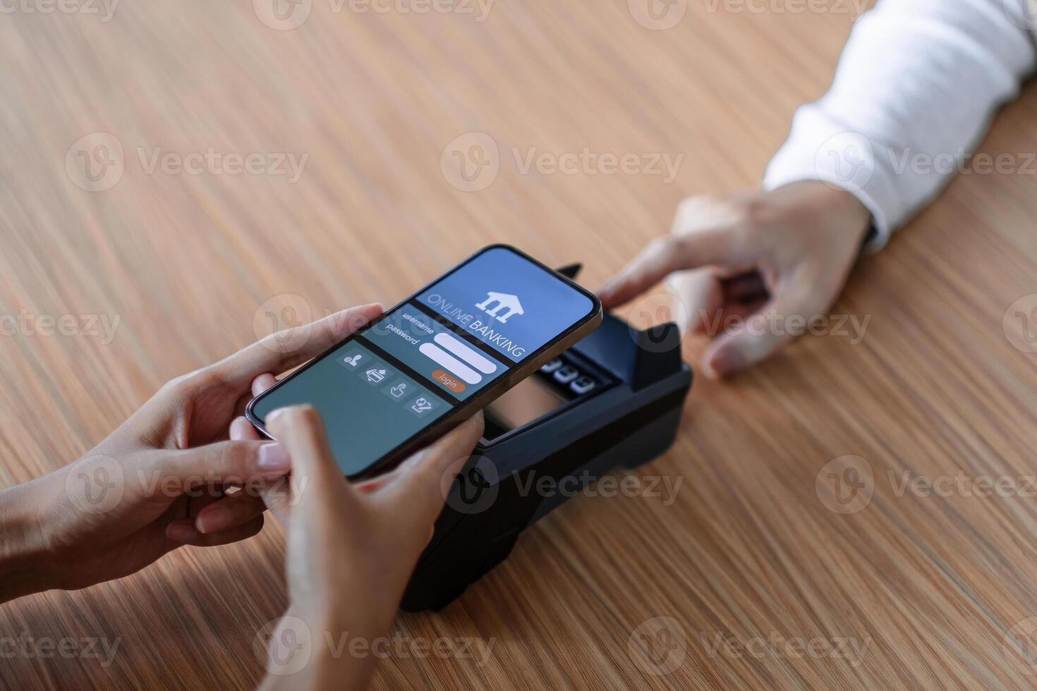 Close up customer make mobile payment contactless paying with NFC technology on smart phone. photo