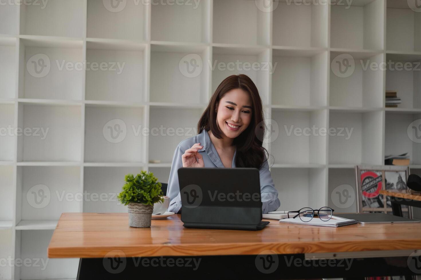 Young asian teacher giving online lessons conference calling on digital tablet talk by webcam learn teach in online chat, distance webinar online teaching concept photo
