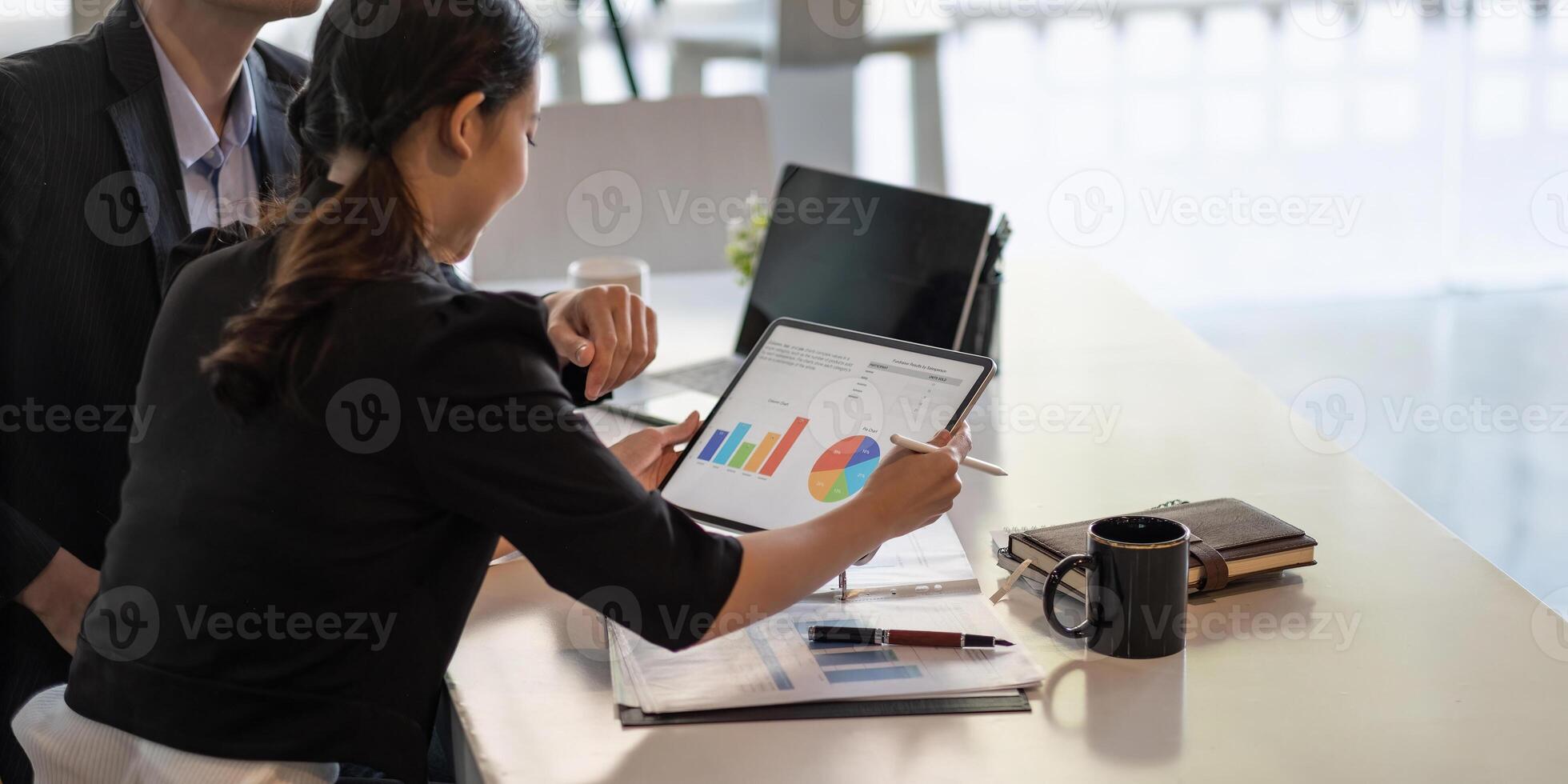 Business adviser analyzing financial figures denoting the progress in the work of the company, Business Discussion Concept photo