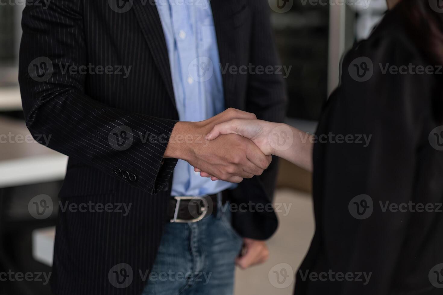 Close up of Business people shaking hands, finishing up meeting, business etiquette, congratulation, merger and acquisition concept. photo